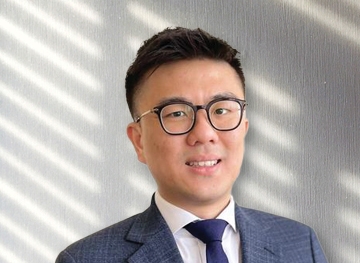 headshot of Favian Chong on grey background