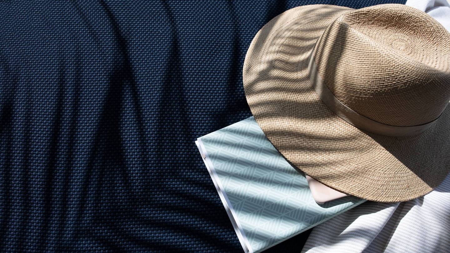 A hat laying on a sun shade